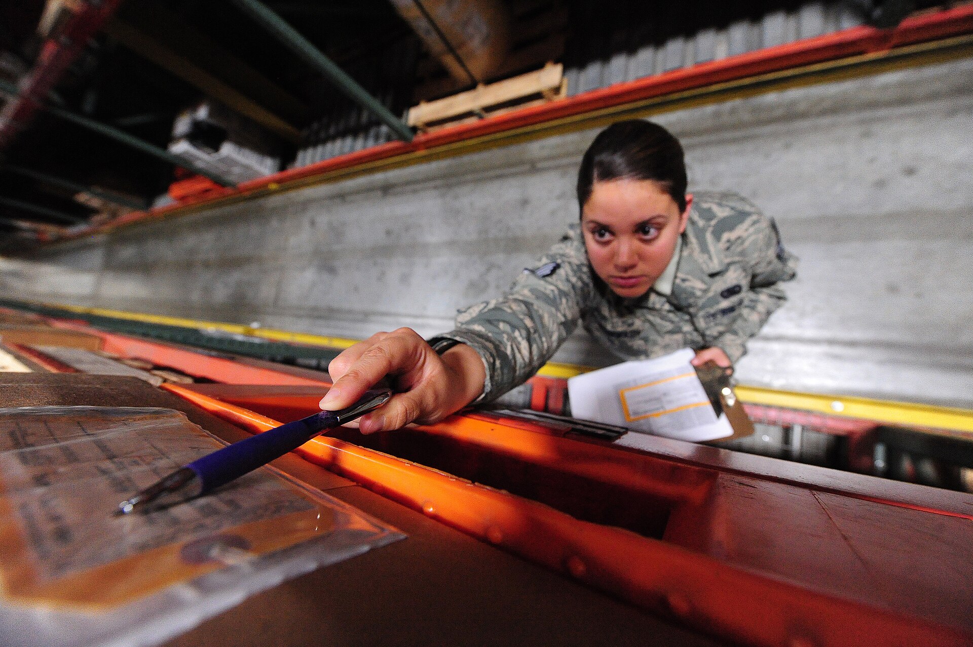 Warehouse staff checking inventory and quality records